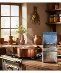Copper pot on a stove with a bag of Acquerello coffee in a kitchen setting