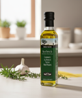 Bottle of black truffle oil on a kitchen counter with ingredients in the background