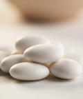 Close-up of white almonds on a light background
