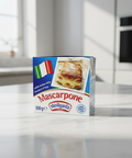 Box of Sterilgarda Mascarpone cheese on a reflective surface with a blurred background