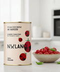 Nylano cherry tomatoes can with a bowl of tomatoes on a kitchen counter