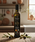 Bottle of Clemente olive oil on a wooden surface with olives and kitchen background