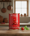 Red can of Rosso Gargano cherry tomatoes on a wooden kitchen counter.