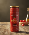 Red canister labeled 'ROSSO Gargano' on a wooden surface with tomatoes and olive oil in the background.