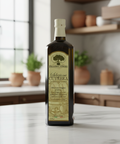 Bottle of Frantini Cutrera olive oil on a kitchen counter with a blurred background