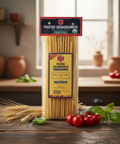 Pasta Gragnanesi package on a wooden table with tomatoes and basil