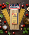 Two packages of Pasta Gragnanesi with ingredients on a wooden surface