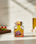 Jar of saffron with a colorful label on a kitchen counter